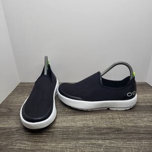 OOFOS Women's Slip-On Athletic Shoes in Black with White Sole